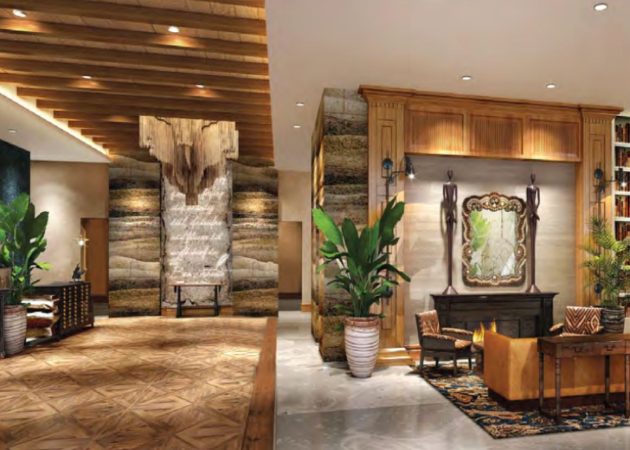 Interior view of a modern lobby featuring wood accents, plants, and a decorative fireplace.