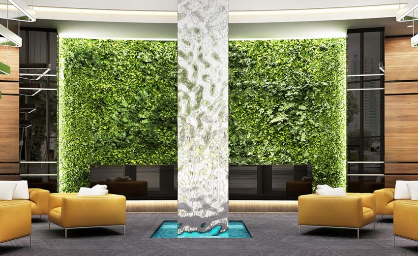 Interior view featuring a decorative plant wall and modern seating arrangement in a lobby.