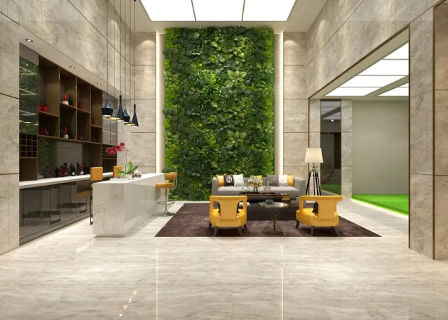 Faux green wall featuring various plants in a hotel reception lobby setting.
