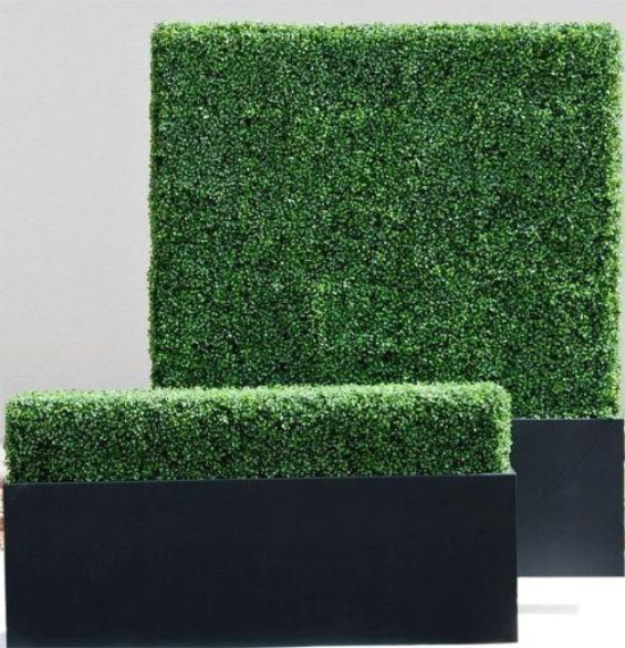Two rectangular planters containing faux boxwood hedges in a green color.