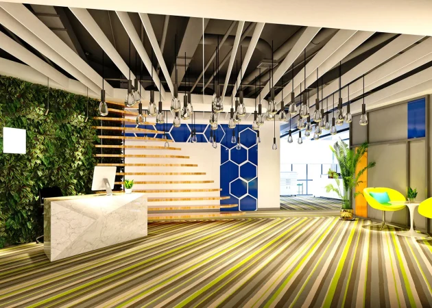 Interior view of a modern office reception area with green wall and unique lighting.