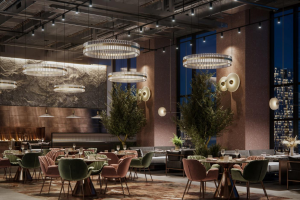 Interior view of a modern restaurant featuring chandeliers and various seating arrangements.